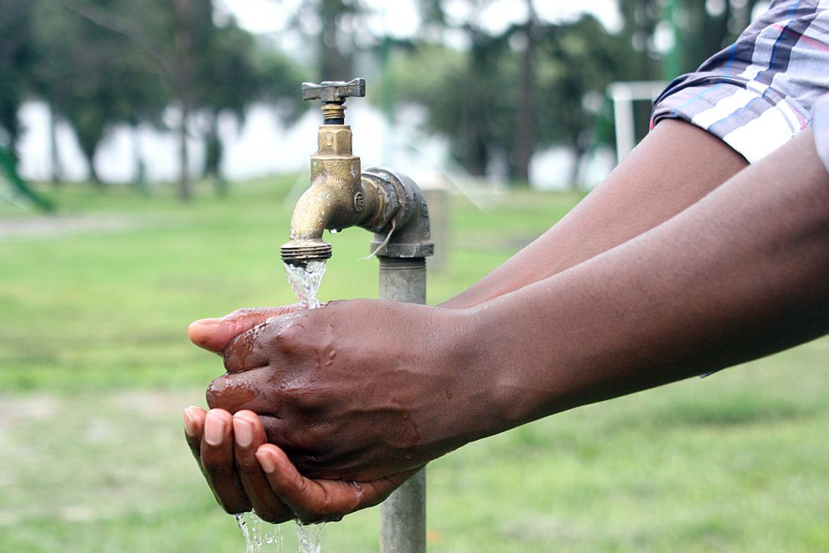 Washing hands at a water tap